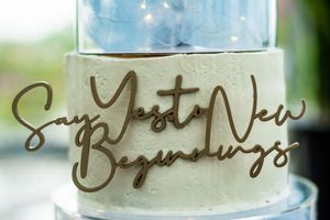 Decorative calligraphy text details on wedding signage or decor.
