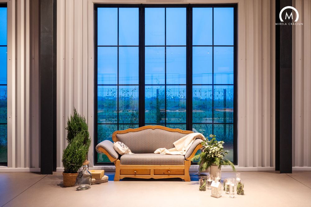 Modern luxury penthouse living room with floor-to-ceiling windows offering panoramic city views and elegant furnishings.