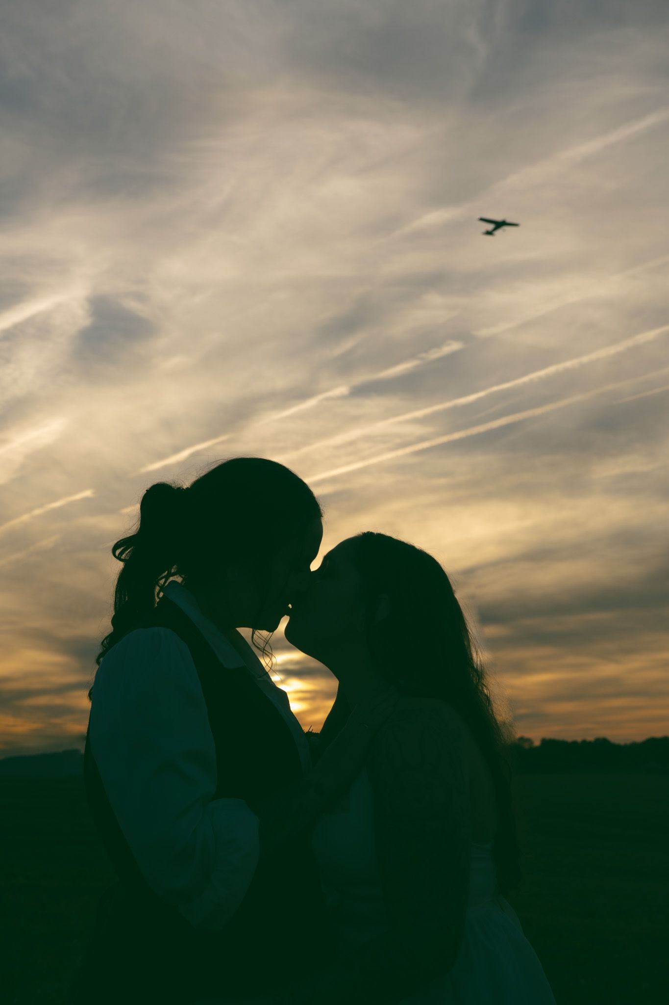 romantic silhouette lgbtq couple sunset airplane elopement adventure wedding NC SC TN GA