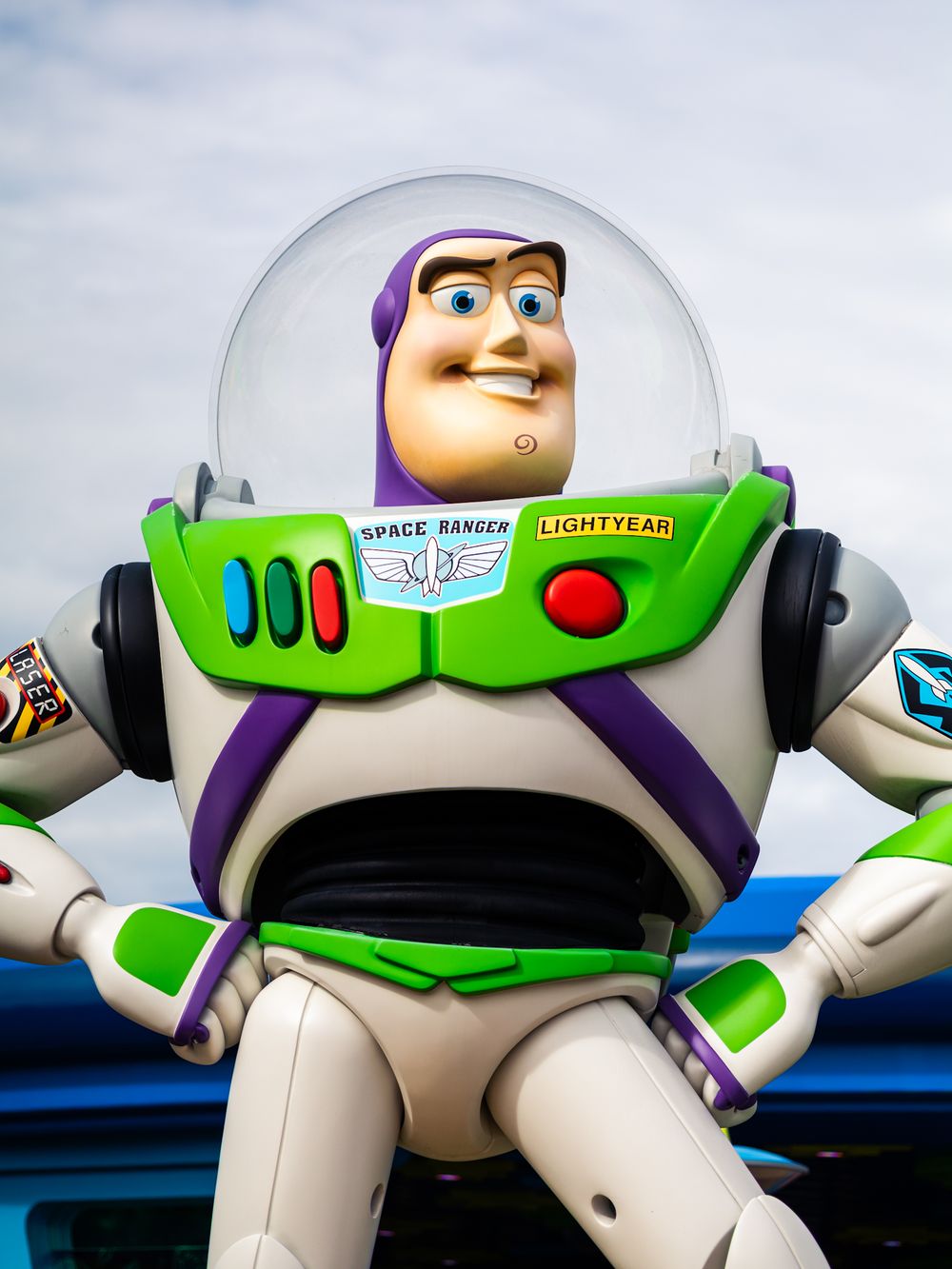 Buzz Lightyear toy figure display from Toy Story in white and green colors.