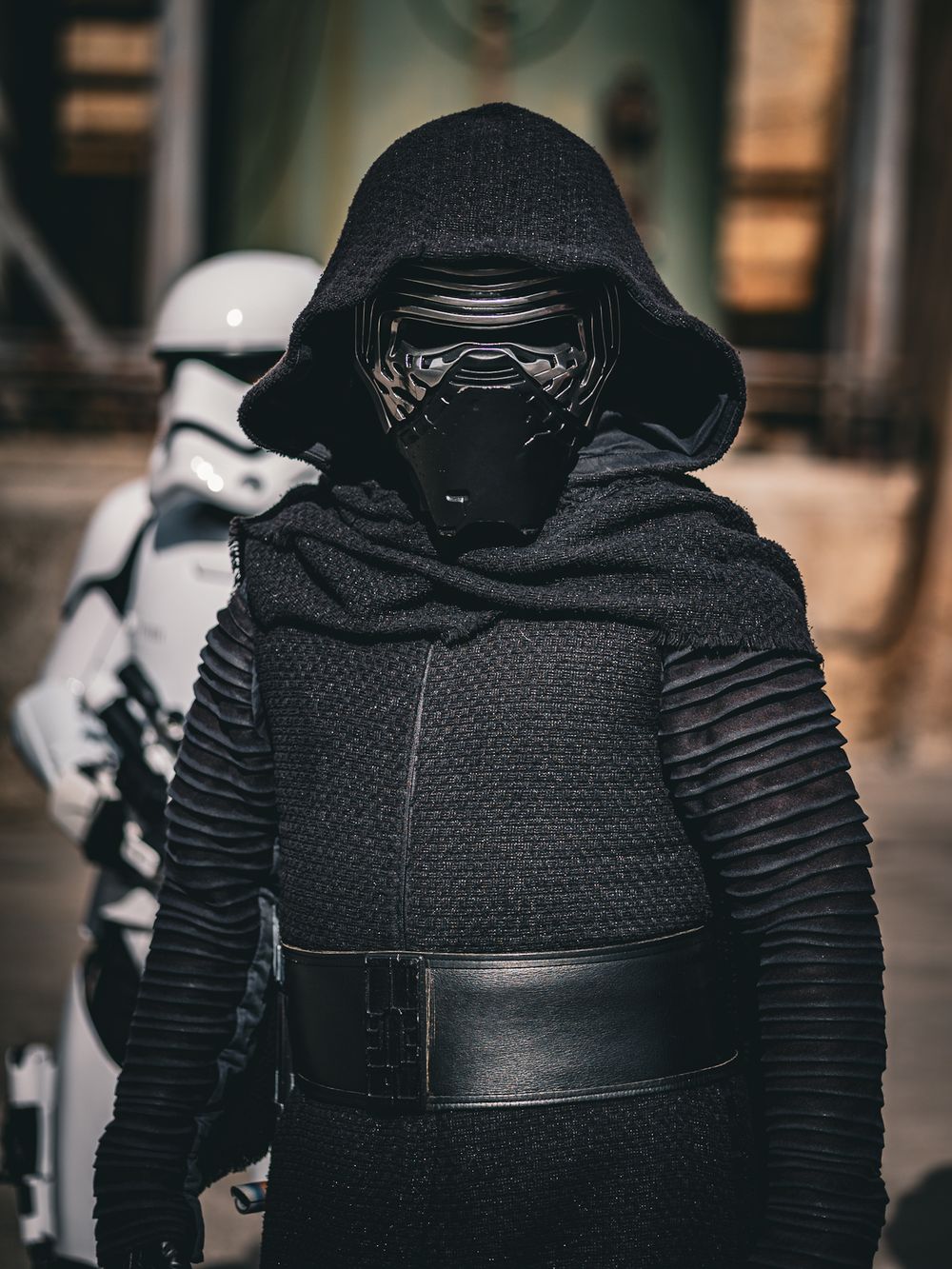 Close-up details of Kylo Ren's black textured costume and mask from Star Wars.