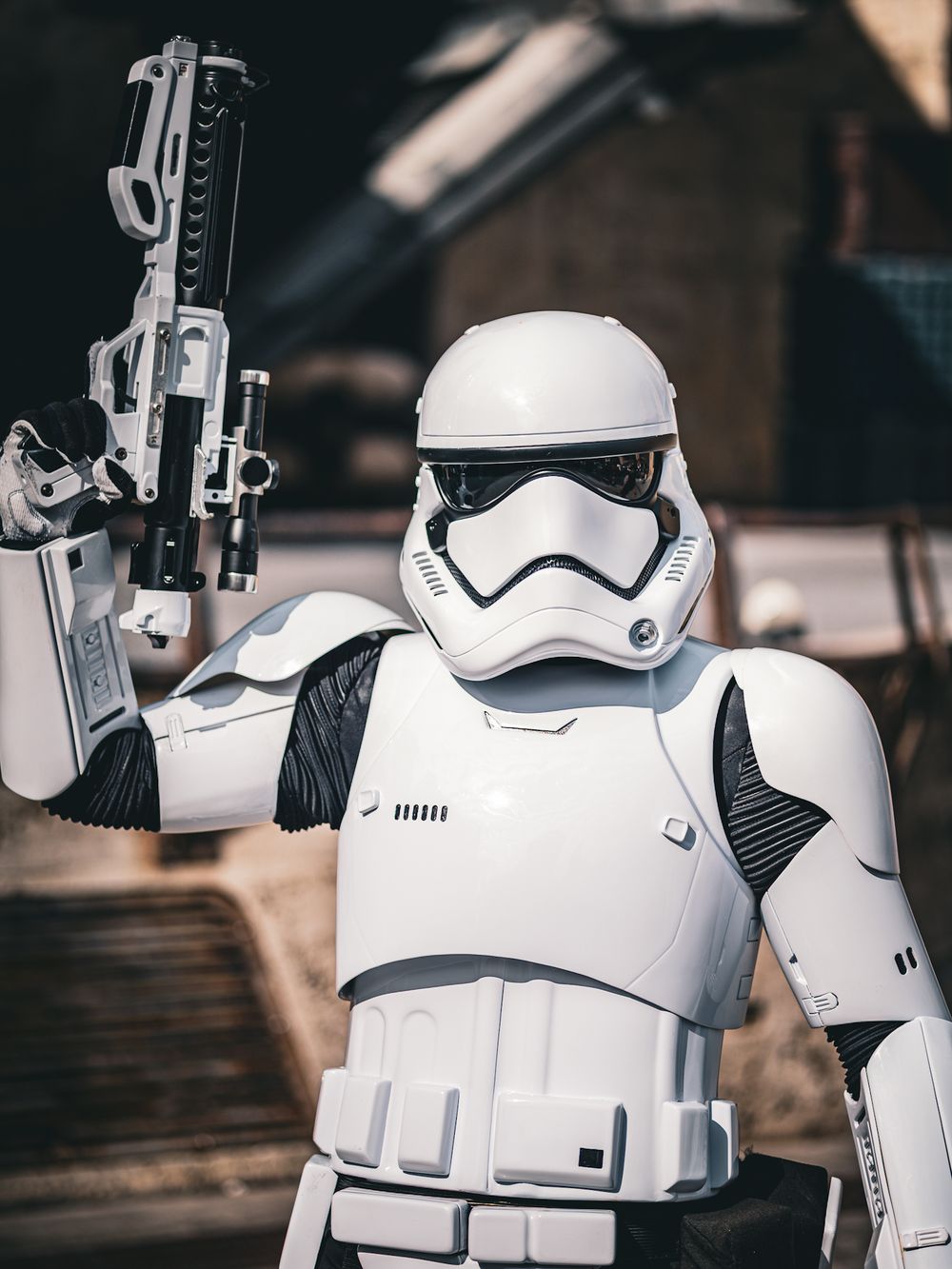 First Order Stormtroopers from Star Wars stand at attention with their weapons.