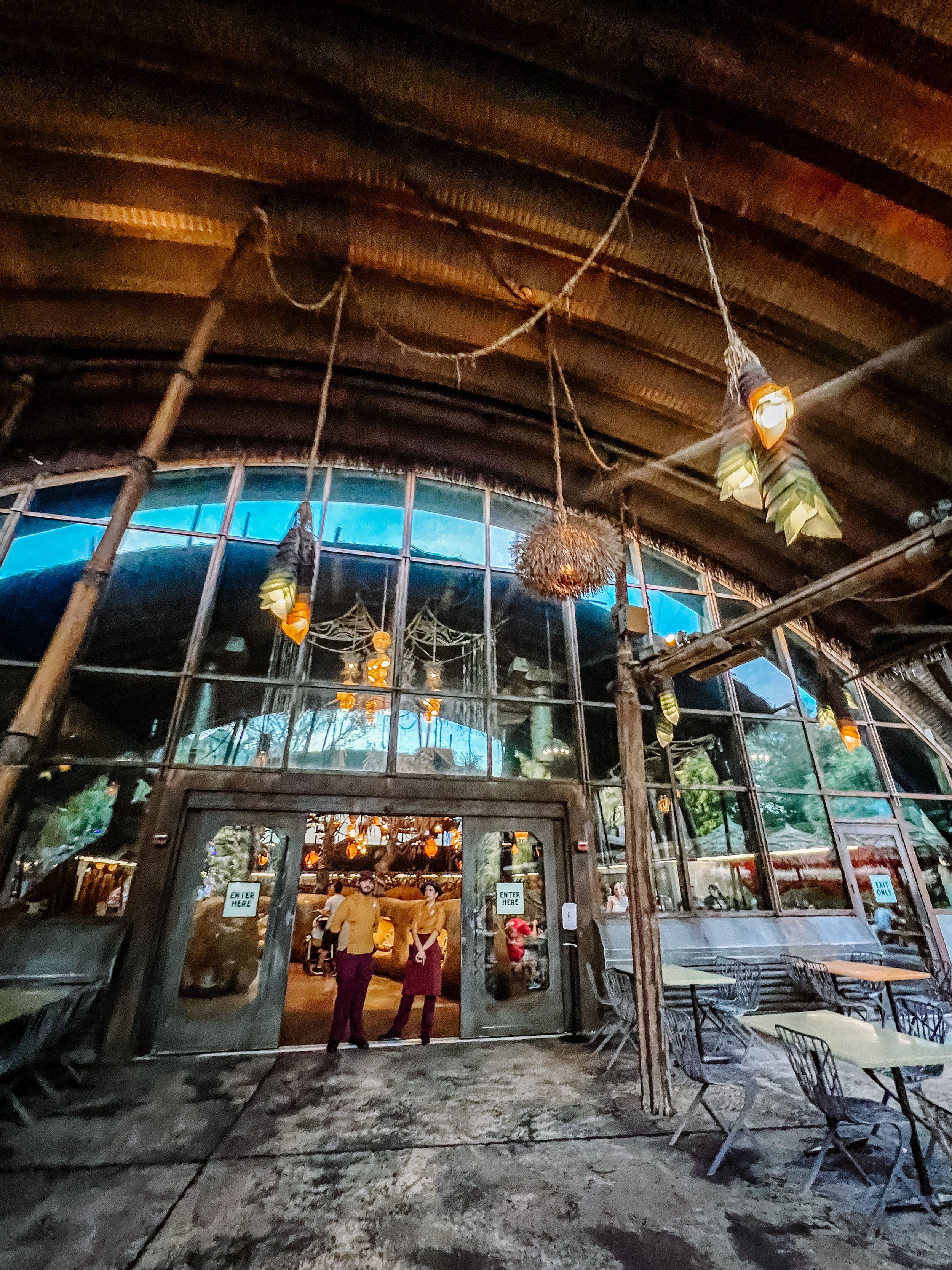 Panoramic view of an underground tunnel system with wooden beams and industrial lighting creating an eerie atmosphere.