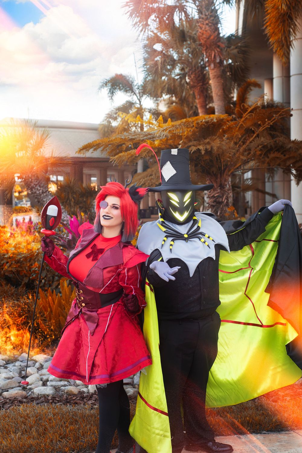 Hazbin Hotel Duo Cosplay photography at Holiday Matsuri showcasing dynamic character poses with staff prop