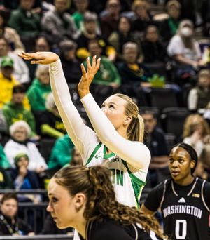 Oregon Ducks women's basketball player shoots during a home game against the Washington Huskies.