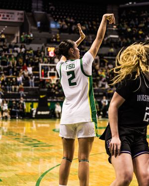 Oregon Ducks player #2 shoots a basketball during a women's college game against Washington.