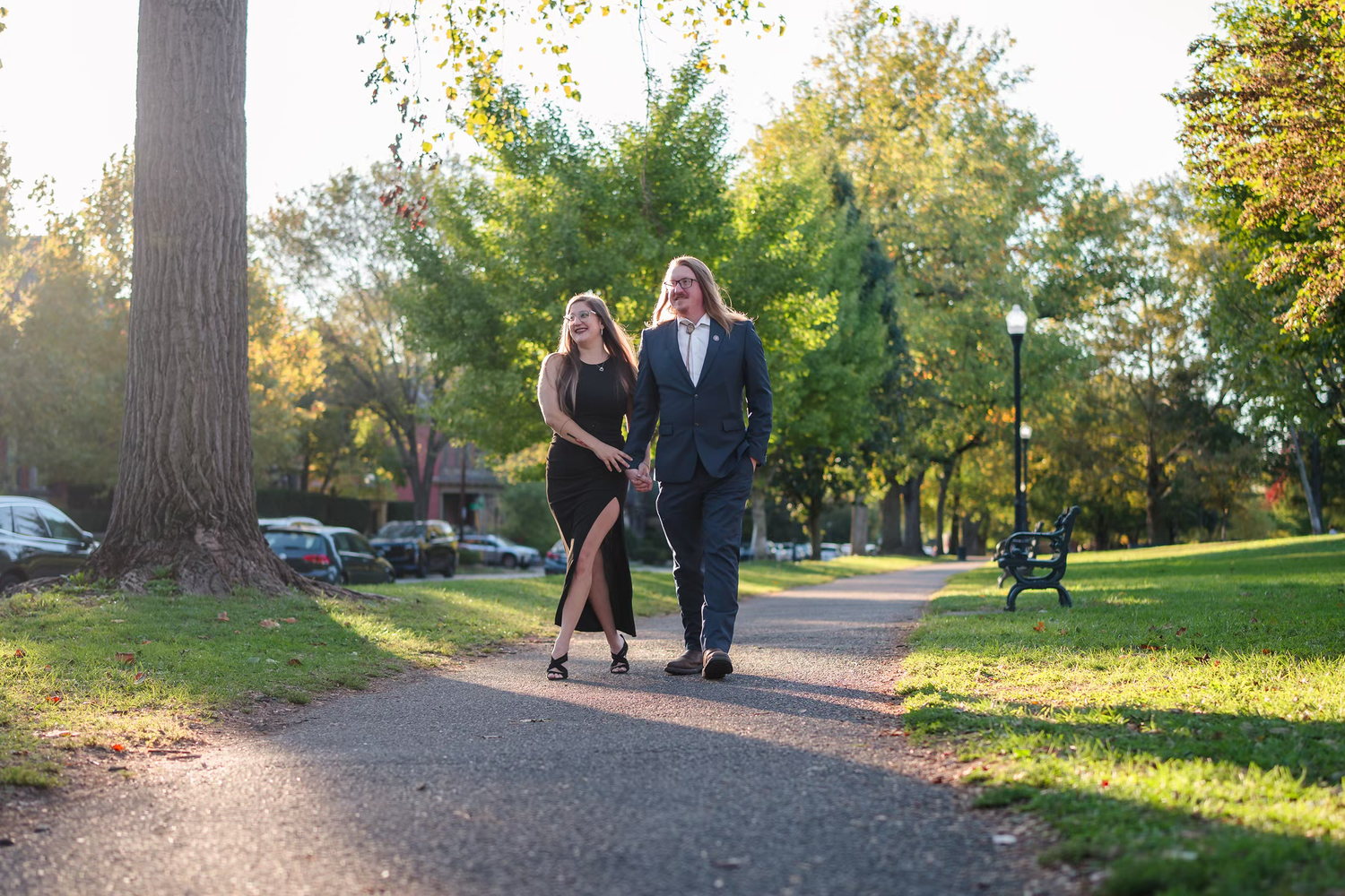 Couple dressed in formal attire walking together for German Village Engagement Photos
