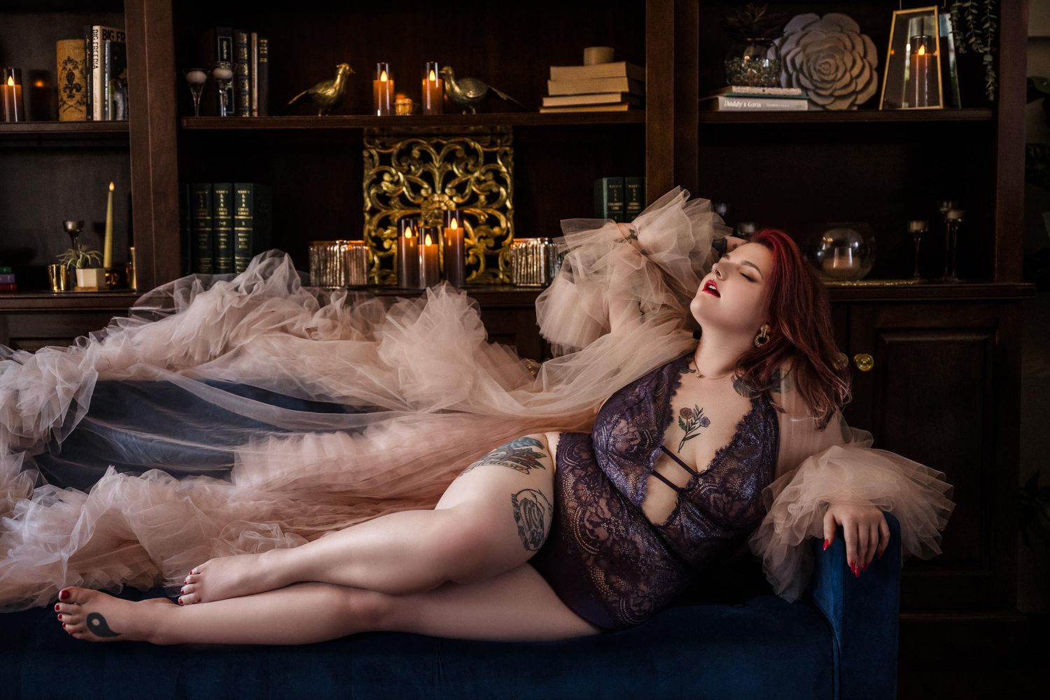 Artistic boudoir photo in moody library setting with lace lingerie and dramatic lighting. confident boudoir poses for women