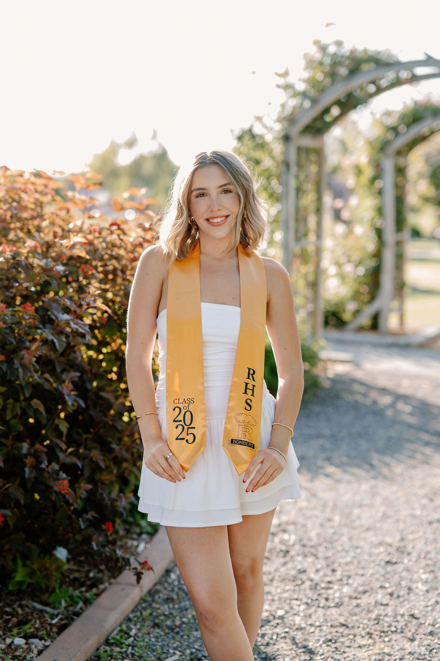 Garden senior pictures in the spring at golden hour