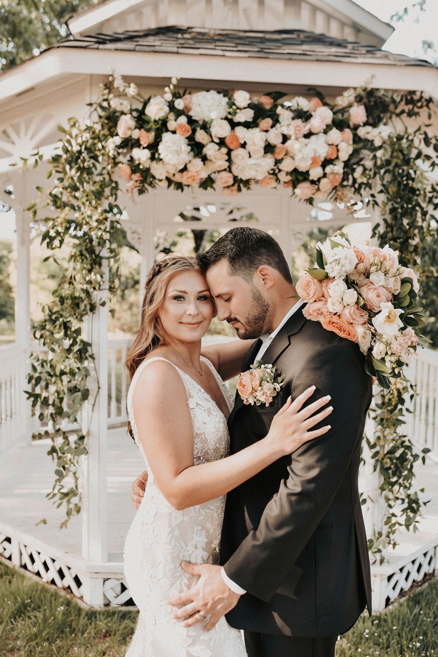 Romantic editorial portrait of bride and groom during their spring wedding at Towering Oaks Wedding Venue.