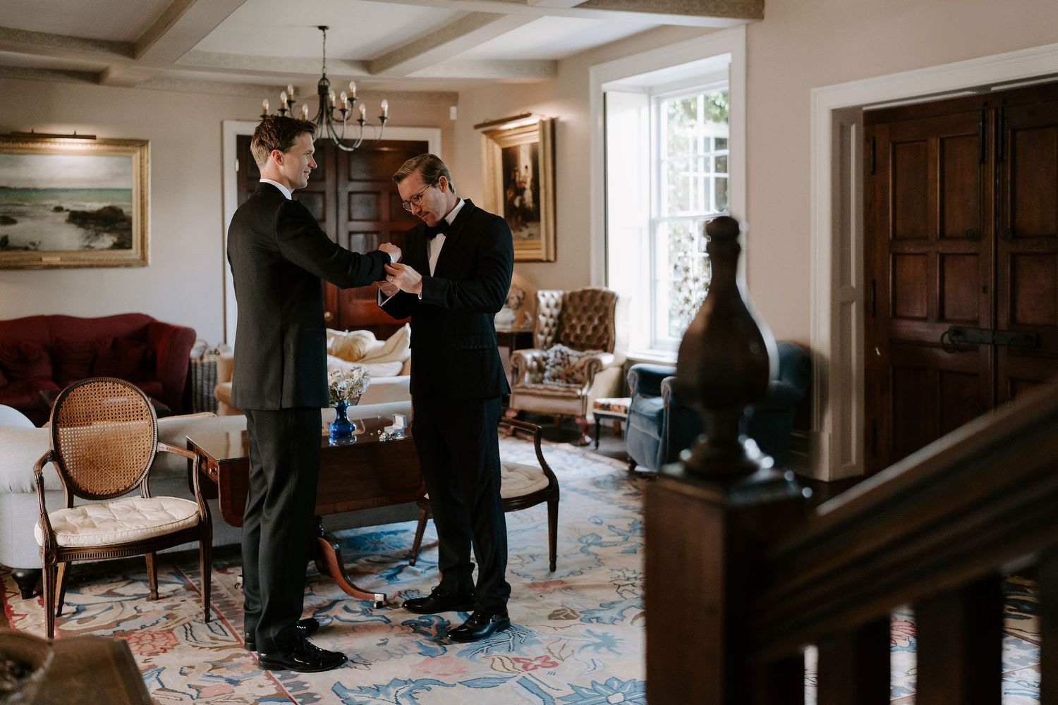 best men helping with grooms cufflinks at dewsall court in herefordshire