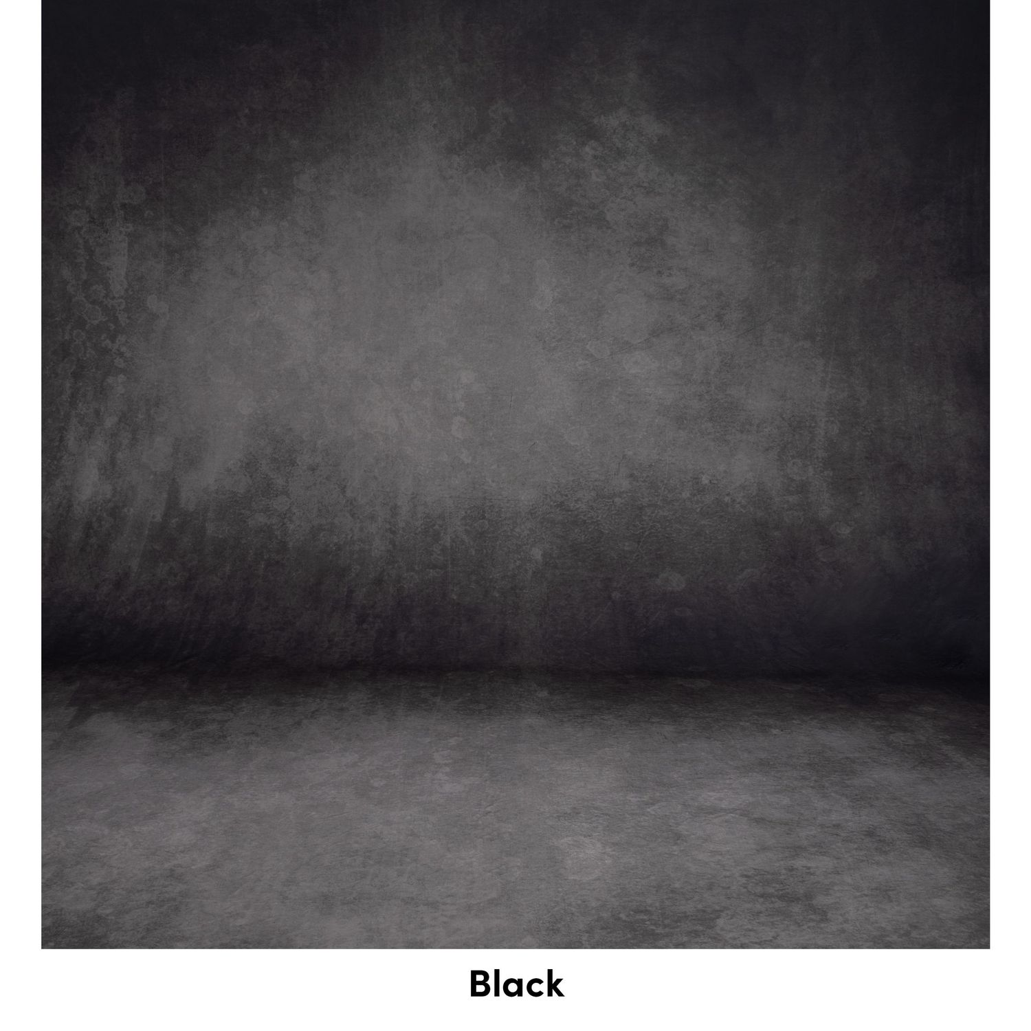 Dark gray textured backdrop with gradient shading from top to bottom creating a moody studio environment.