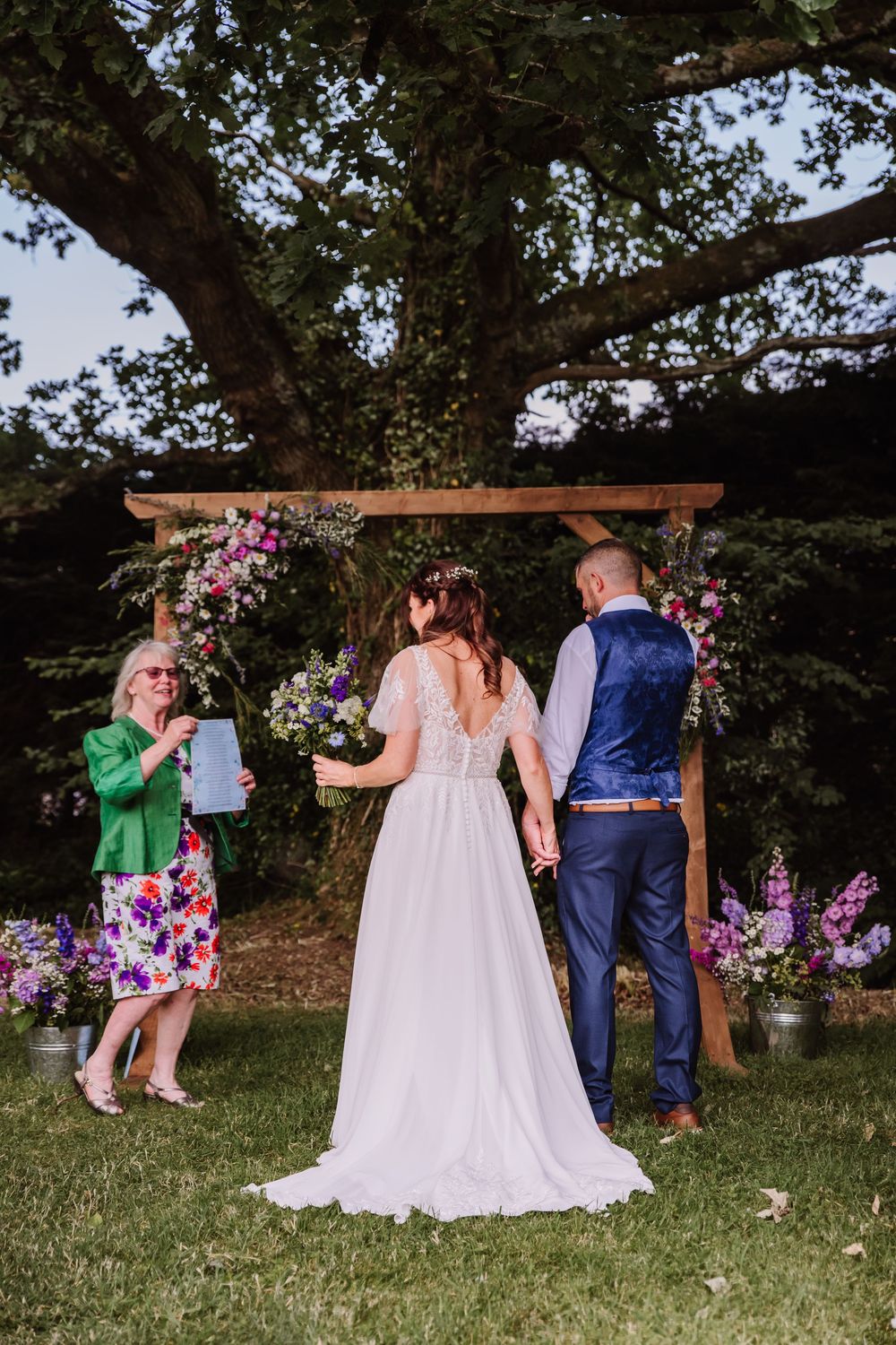 Gaggle of Geese Tipi outdoor wedding venue in Dorset with wooden archway. Wedding photographer Dorset