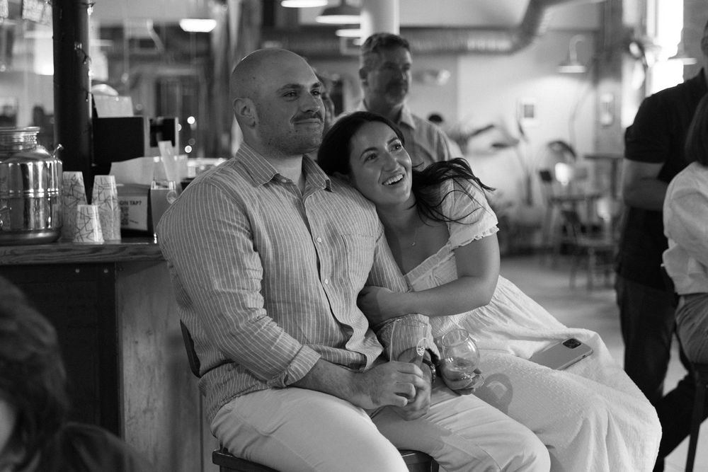 Black and white photo sequence showing couple dancing together in romantic, intimate poses at a social gathering.