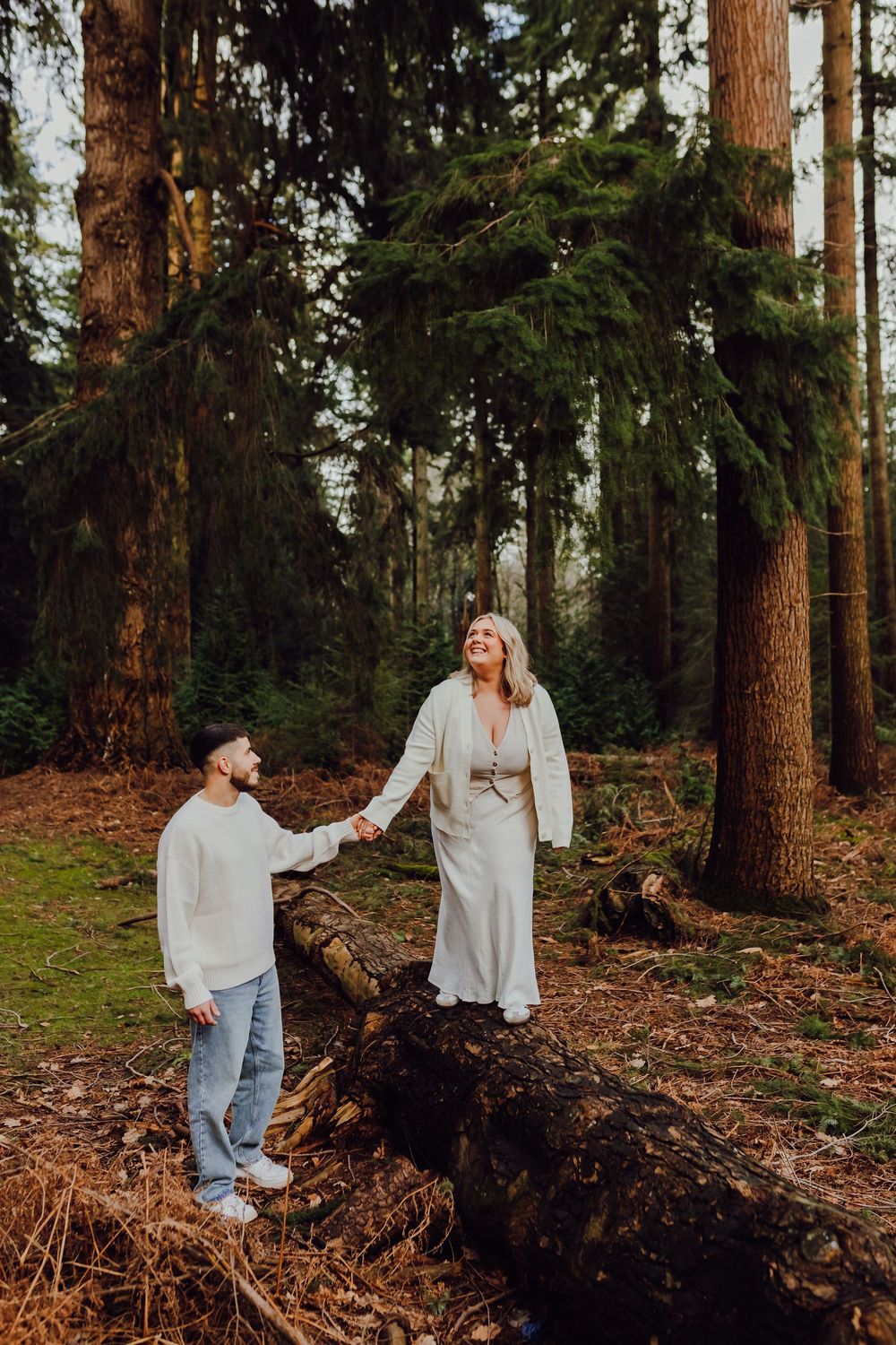 Romantic portrait of the couple standing together, surrounded by nature.