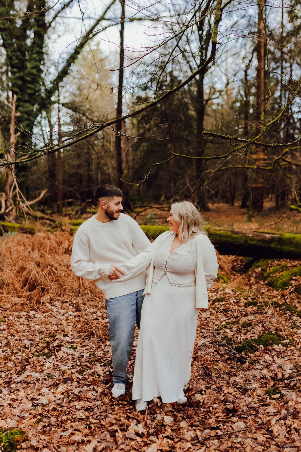 Hannah and Jordan are cuddling during their pre-wedding photo session.