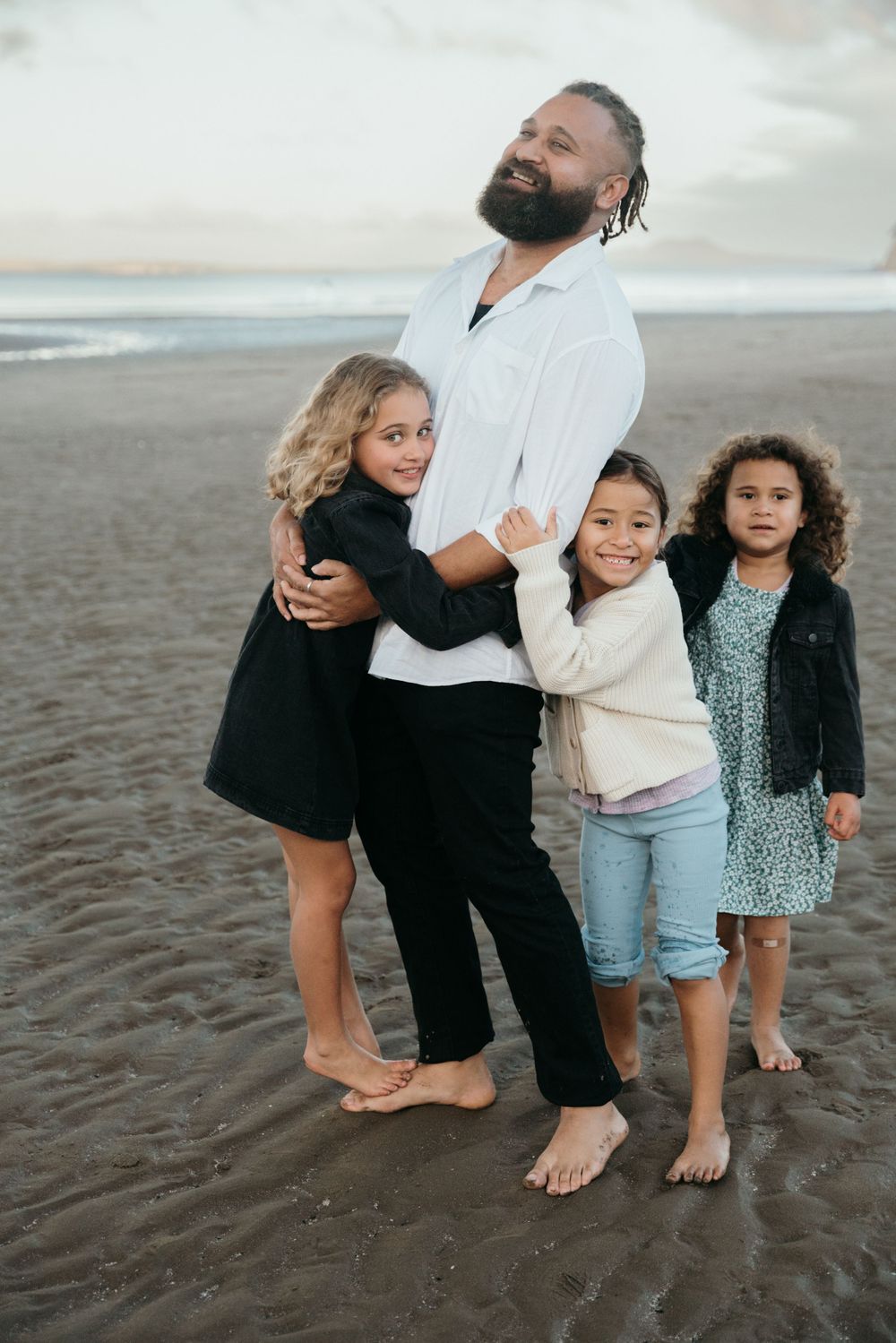 A heartwarming beach portrait showing affection and connection on the sandy shore.