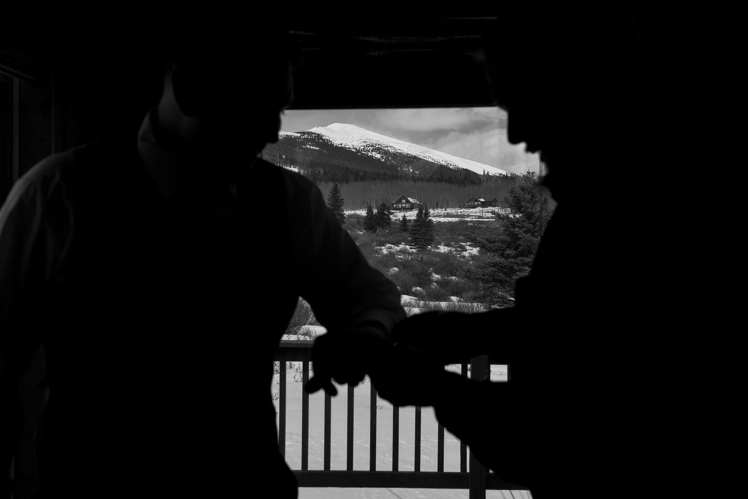 Black and white photographs show a series of architectural details and abstract patterns in dark shadows and light.