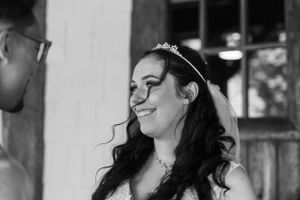 Black and white portrait of a joyful moment during a wedding celebration.