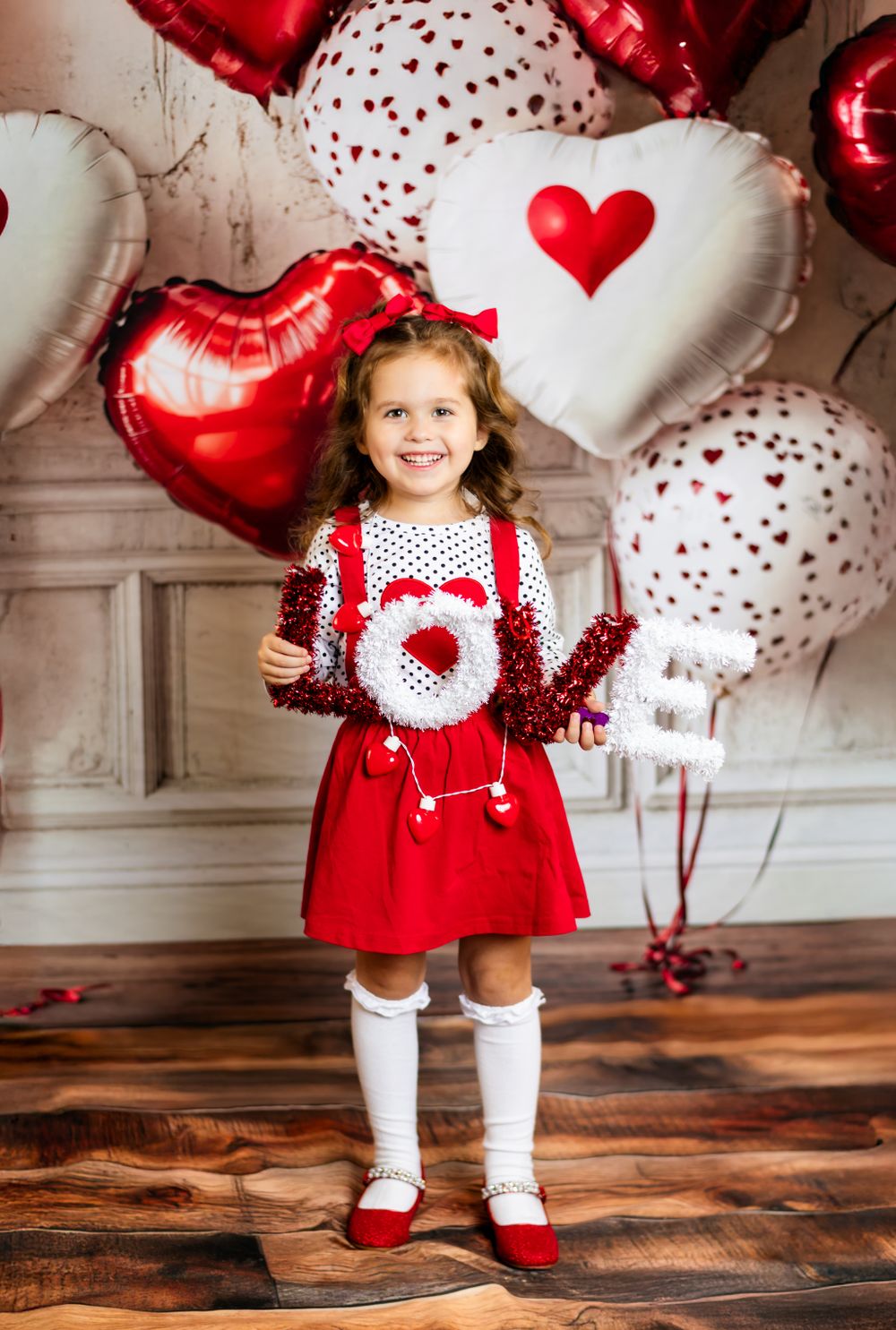 A festive Valentine's Day scene with red and white heart balloons against a light backdrop as decorative elements.