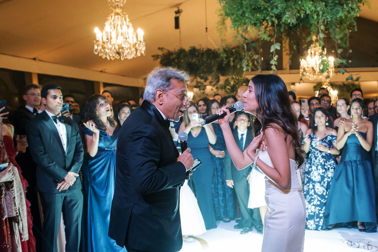 Bride singing with her father during emotional father-daughter dance at Indian destination wedding in Portugal