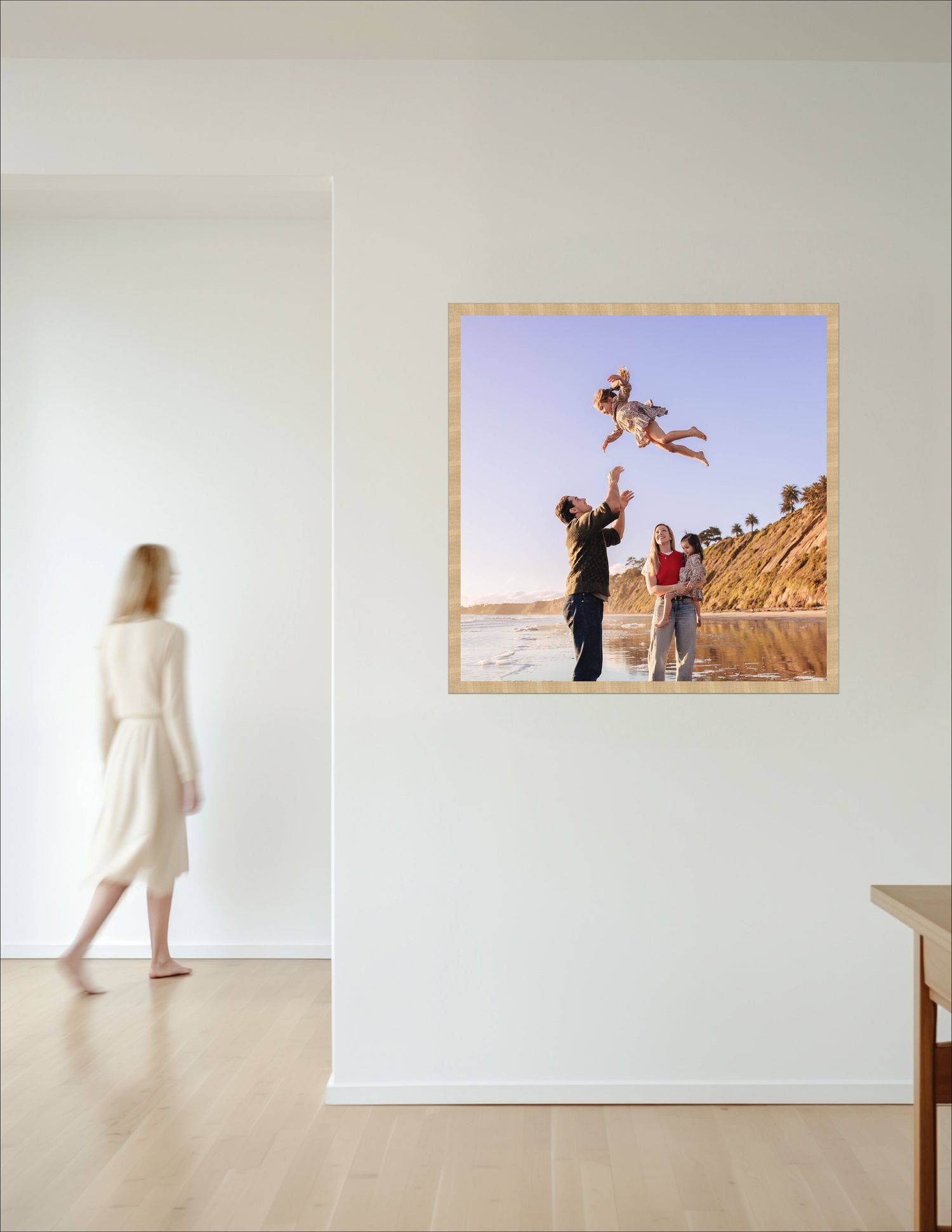 A series of beige and white minimalist bedroom scenes with photo frames above the headboard and palm plant decor.