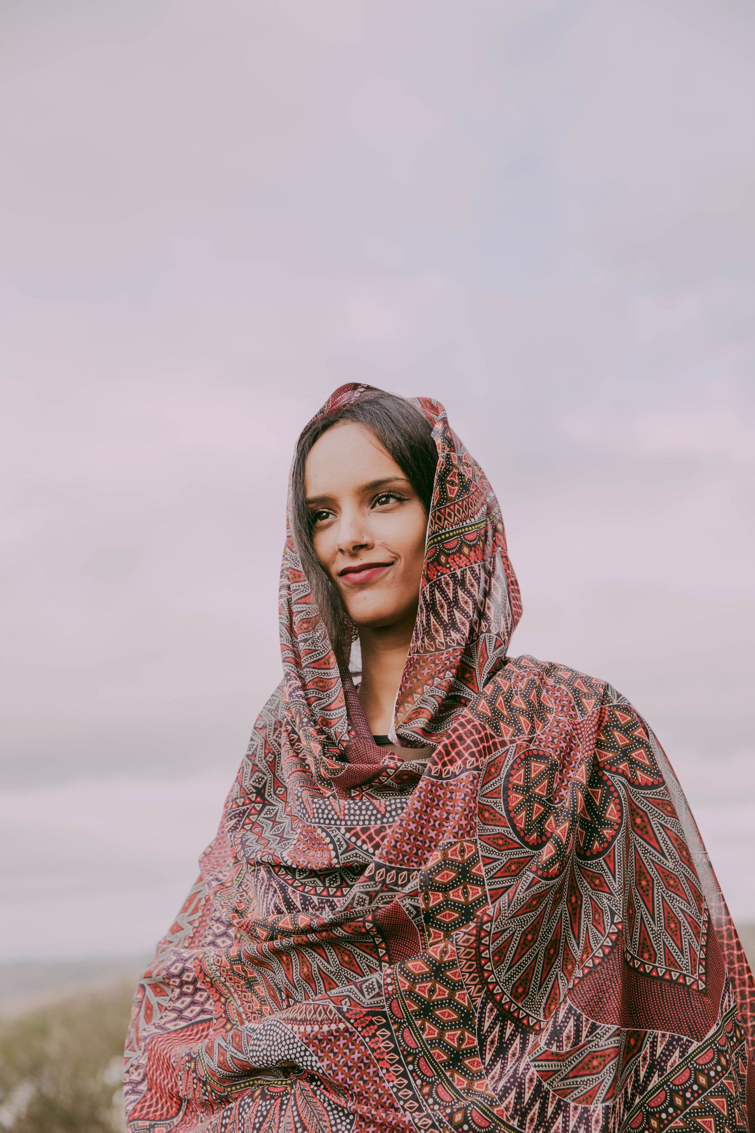 Portrait of Sudanese/Welsh Model, wearing silk Toub in NORTH WALES, designed by HIMA RAHAMA. Jewellery by KUKU Jewellery