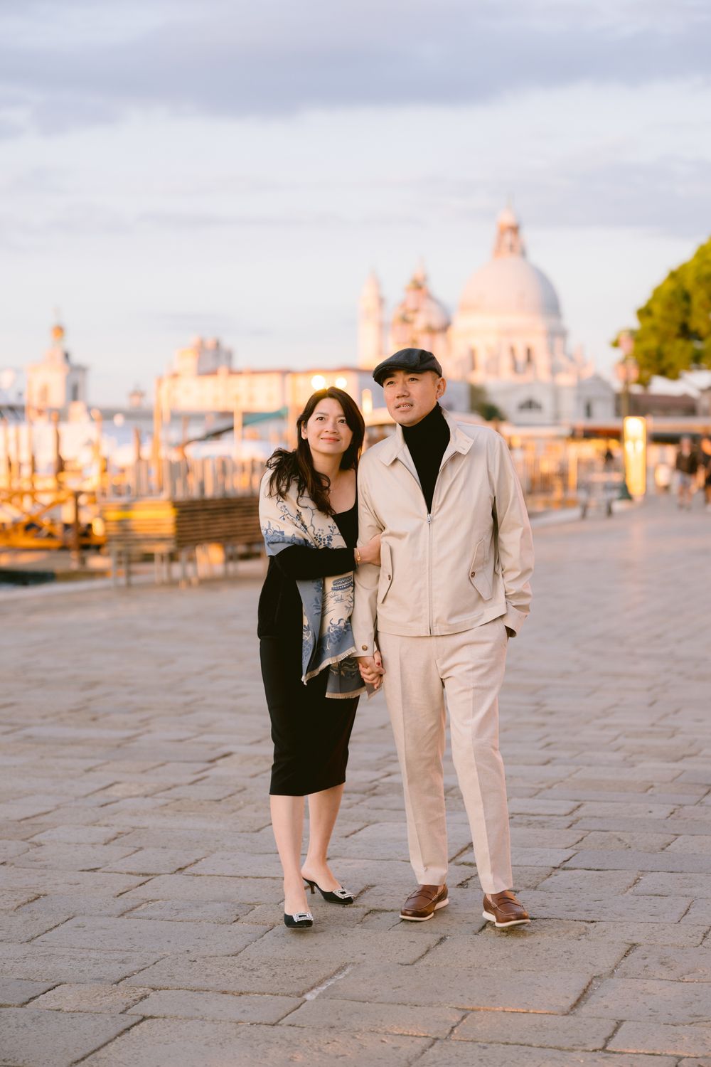 Cobblestone plaza in Venice with historic architecture and warm evening light.