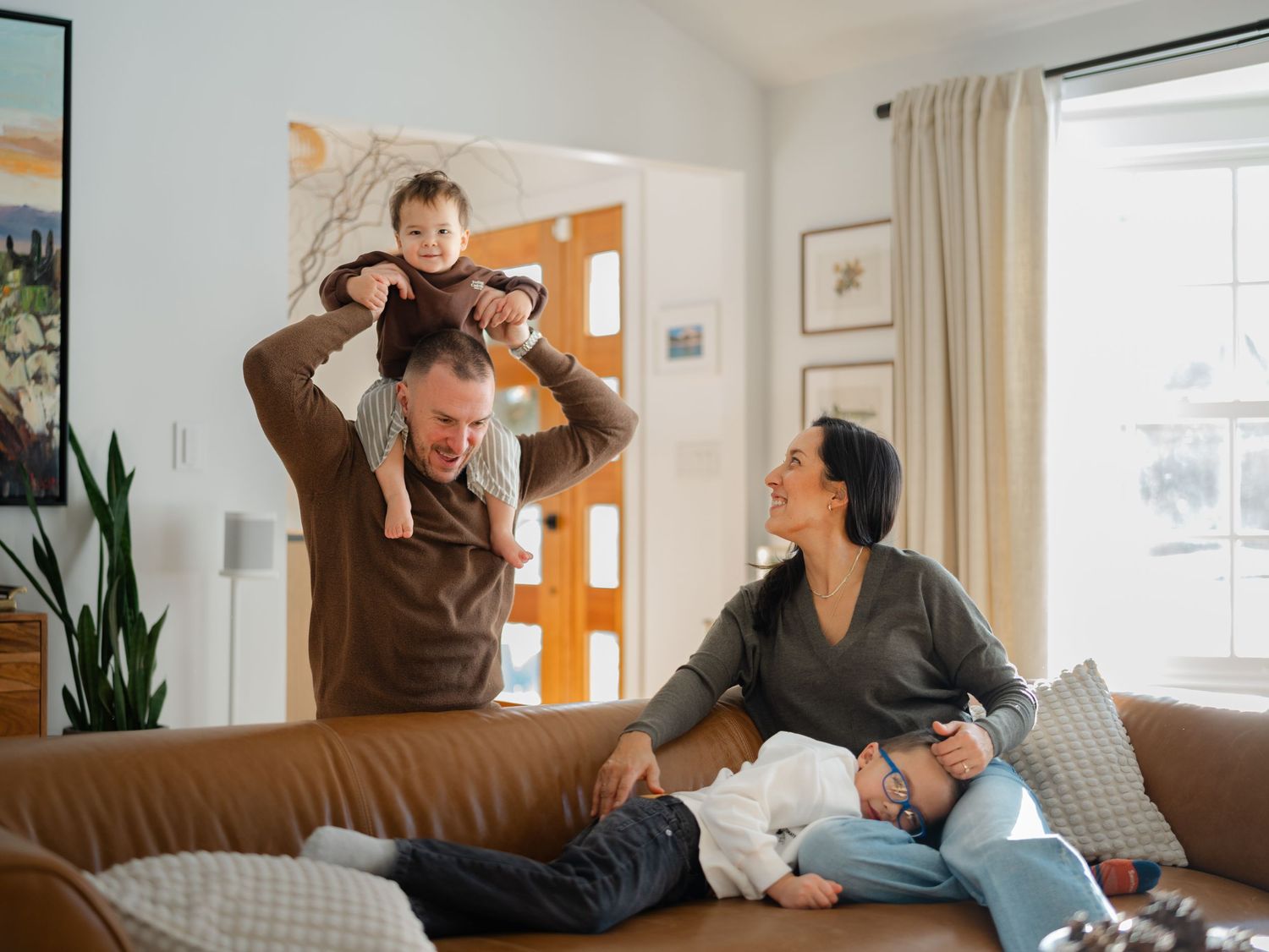 Monmouth County NJ in-home family photographer capturing natural light lifestyle portraits with a family of four.