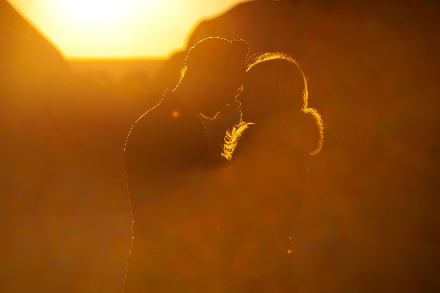Desert golden light and a loving couple. Engagement photography in Joshua Tree.