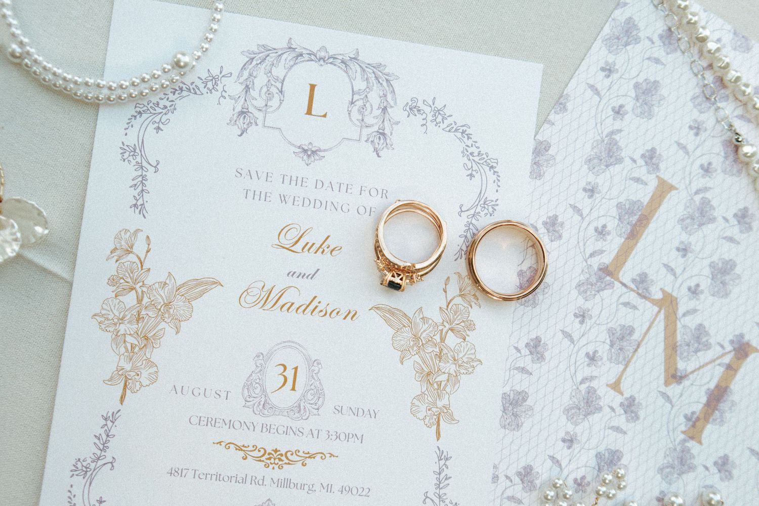 Wedding save the date invitation with gold rings and pearl details for Luke and Madison.