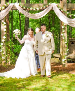 A sequence of wedding photos showing a couple dancing playfully in a garden setting with white drapes and greenery.
