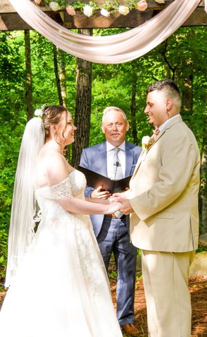 A series of photos showing an outdoor wedding ceremony with white draping and string lights in a wooded setting.