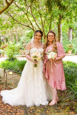 Wedding party photos in a garden setting with bridesmaids wearing dusty rose dresses holding bouquets.