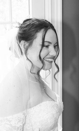 A series of black and white portraits showing a bride in a lace wedding dress looking to the side with soft lighting.