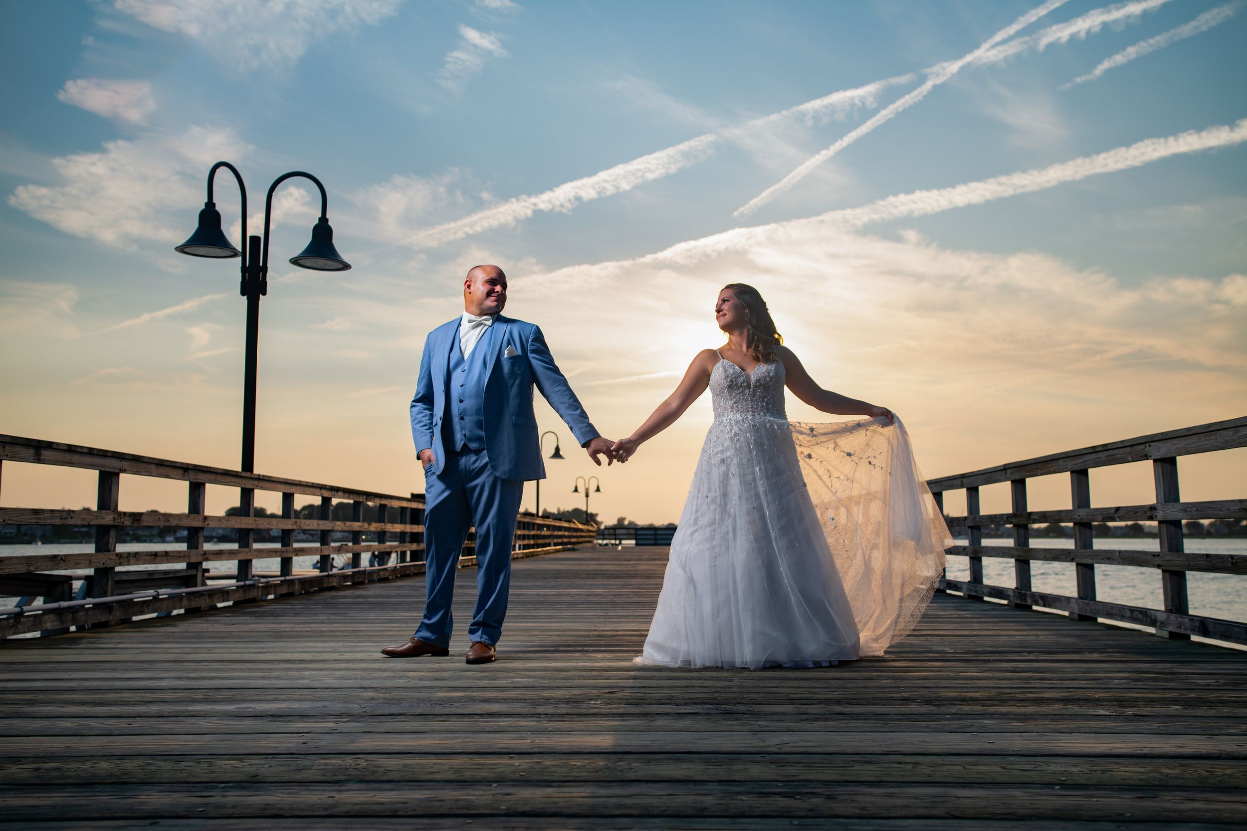 Sunset wedding portraits at the Boat House Tiverton. Candid, authentic moments at this premier Mount Hope Bay wedding venue in RI.