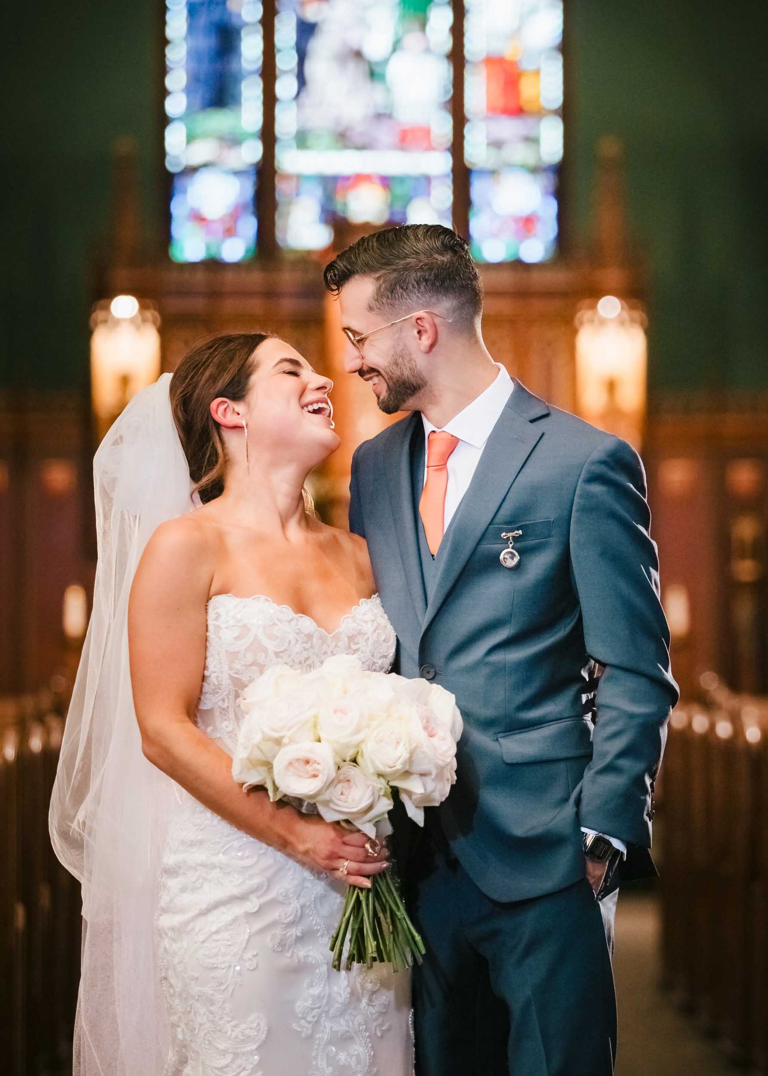 Romantic wedding portrait of bride and groom inside Saint Brigid Church in South Boston