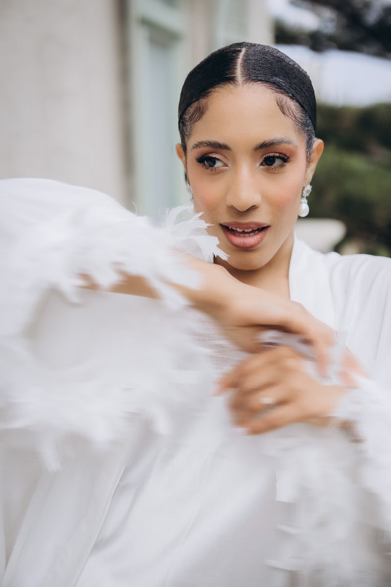Bride getting ready with wedding dress in Barcelona morning light
