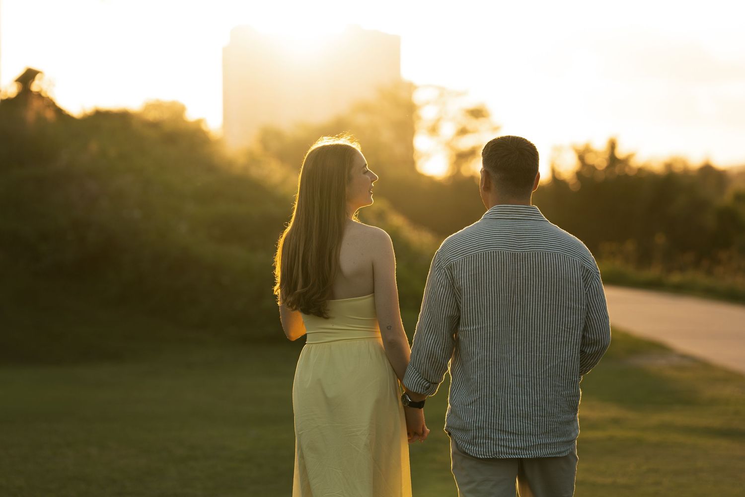 A couple showing off an engagement ring in a series of close-up photos focusing on their hands and shoulders.
