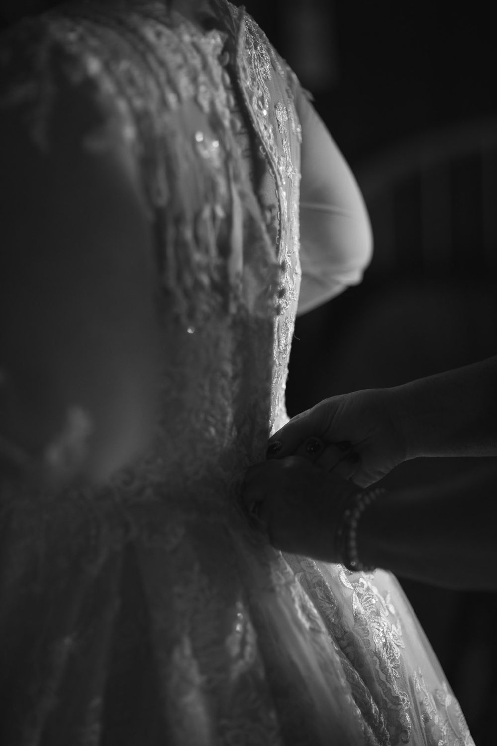 black and white back of dress getting ready for wedding