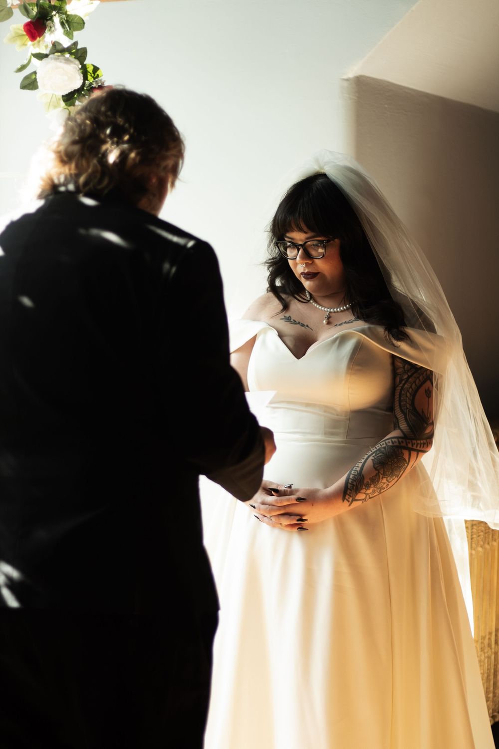 Bride and groom reading vows during ceremony in Carthage, Missouri