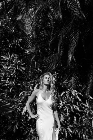 Black and white luxury editorial portrait with statement earrings photographed in Jupiter Florida.