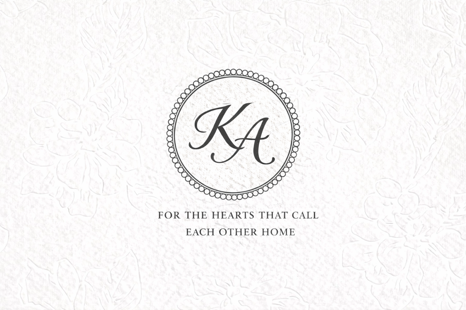 A monogram logo design featuring intertwined letters 'JA' in an elegant oval frame with decorative border details.