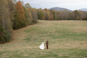 Scenic autumn landscape with rolling hills and golden foliage.