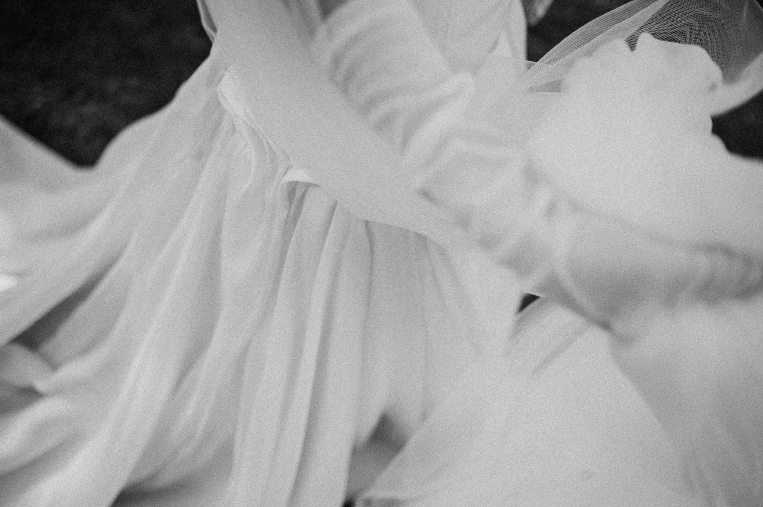 Close-up view of delicate white chrysanthemum petals with soft focus creating an ethereal effect.