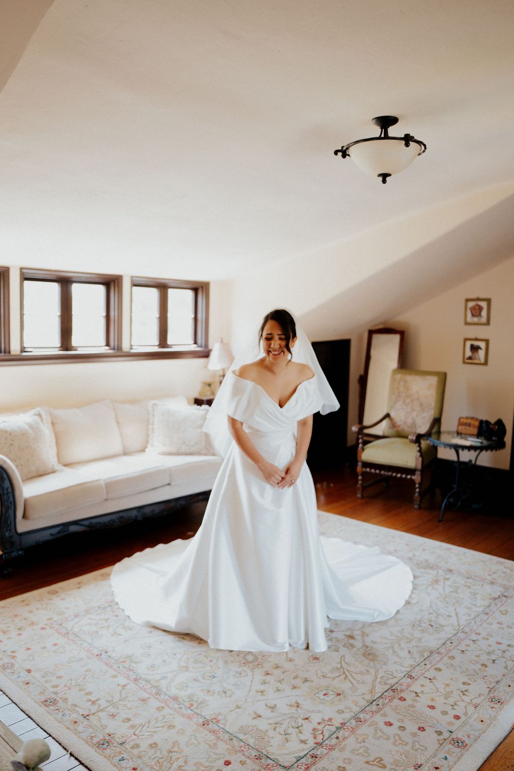 A sequence of photos showing a white wedding dress being displayed on a light-colored floral rug in a bright room.