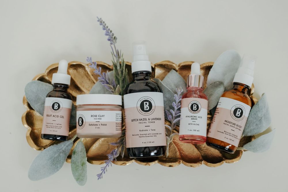 A collection of essential oils and aromatherapy products arranged in a row against a light background.