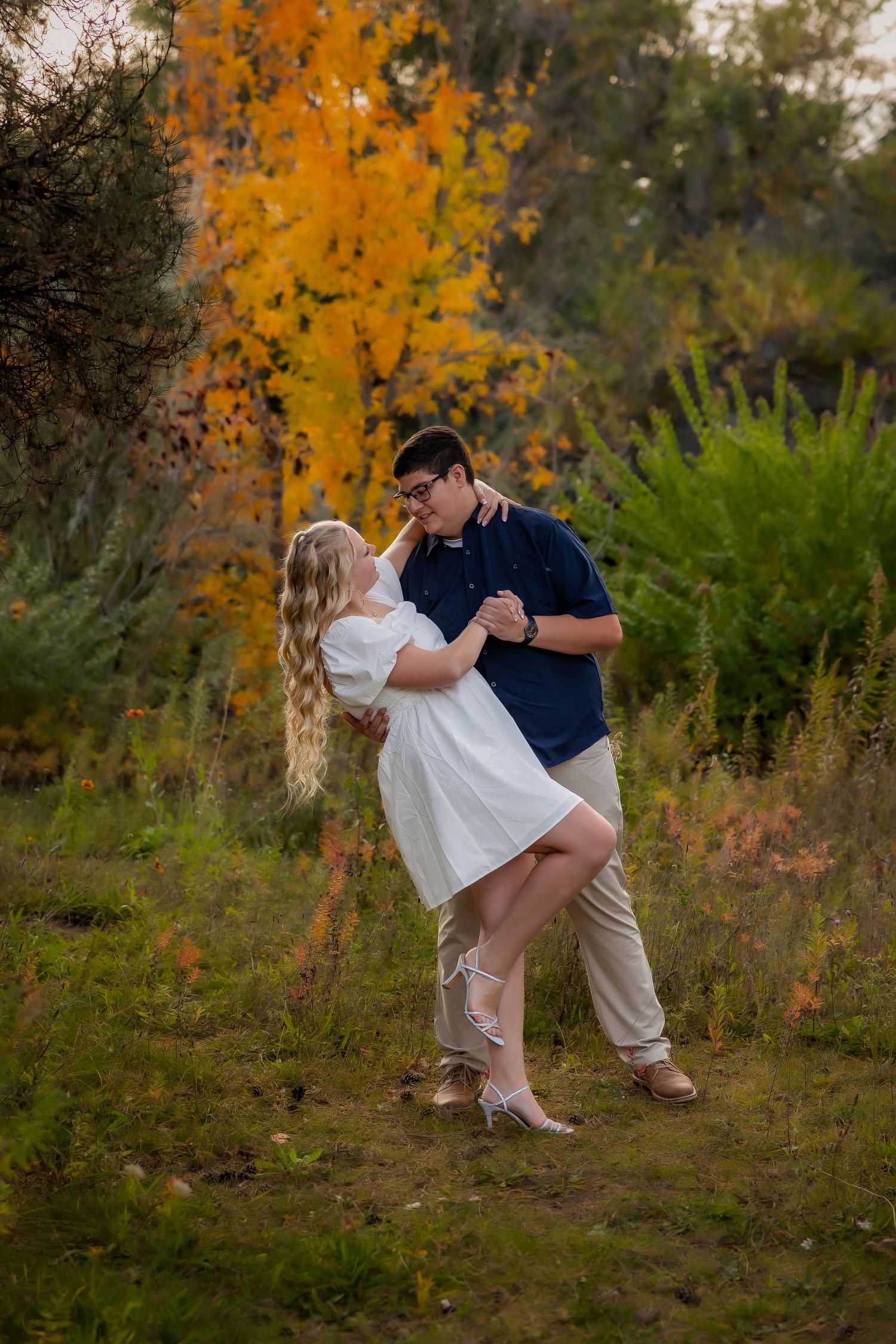 Engagement photo of couple dancing at Kathryn Albertson Park in Boise.