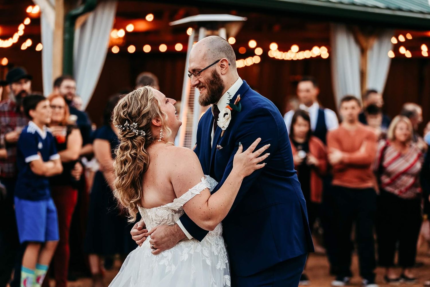 bride and groom dancing for their first dance at an outdoor wedding