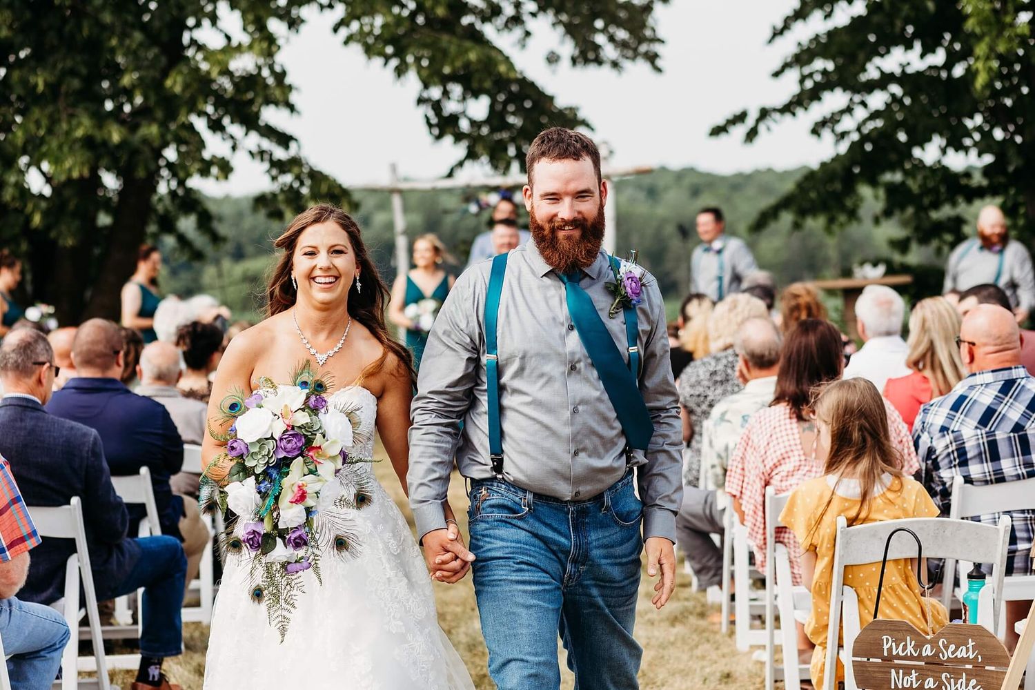 bride and groom leaving their ceremony with smiles